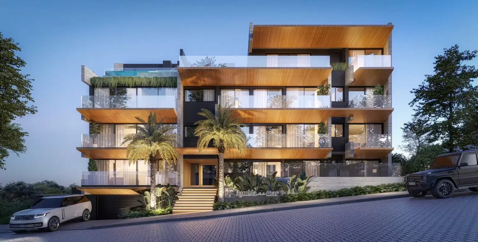 Arquitetura autoral em concreto, madeira e vidro, à beira-mar.